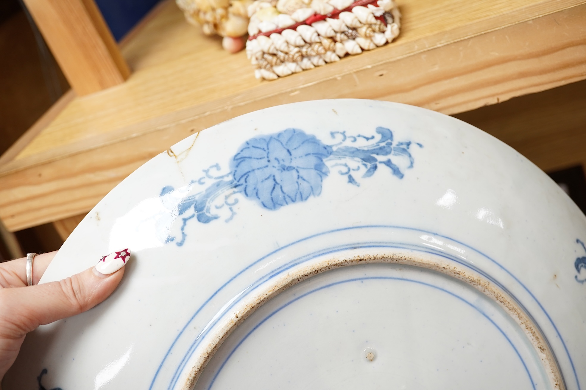 Three large Japanese dishes or chargers to include an Imari pattern example and one depicting Mount Fuji, largest 40cm in diameter